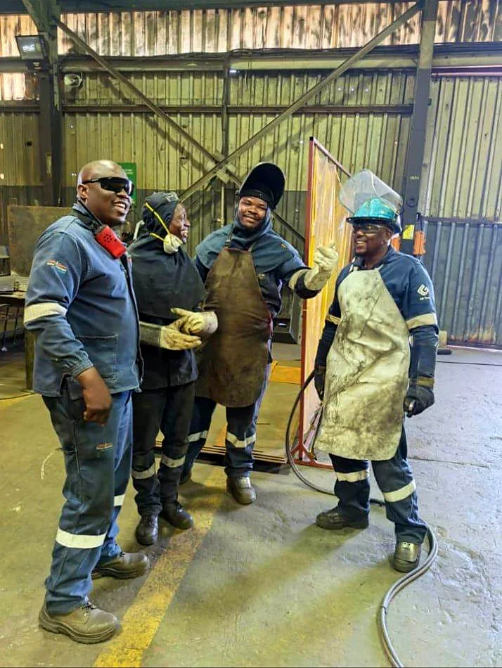 The AM KA NGOBS team in their fabrication workshop